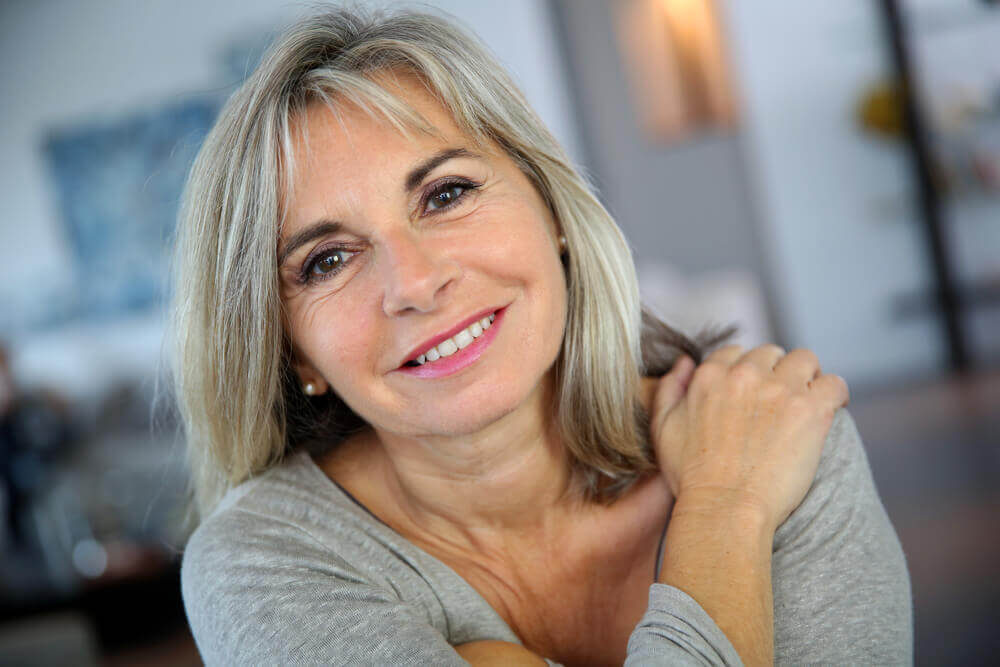 Mature woman smiling at camera