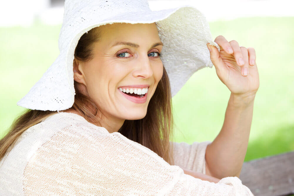 Mature woman in floppy hat