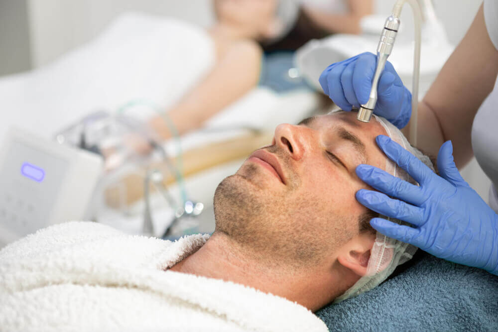 man getting a microdermabrasion treatment