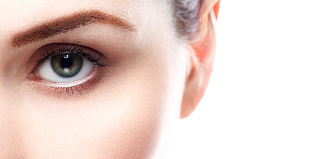 Closeup of a woman's left eye with perfect skin